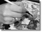 Image of an artist holding a paintbrush, used to illustrate Houghton Hand Therapy's services offered to promote post-operative recovery of the hand in the Doncaster, Retford and Worksop areas.