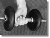 Image of exercise weights being lifted by a hand, used to illustrate Houghton Hand Therapy's services offered to help recovery from sporting injuries to the hand in the Doncaster, Retford and Worksop areas.